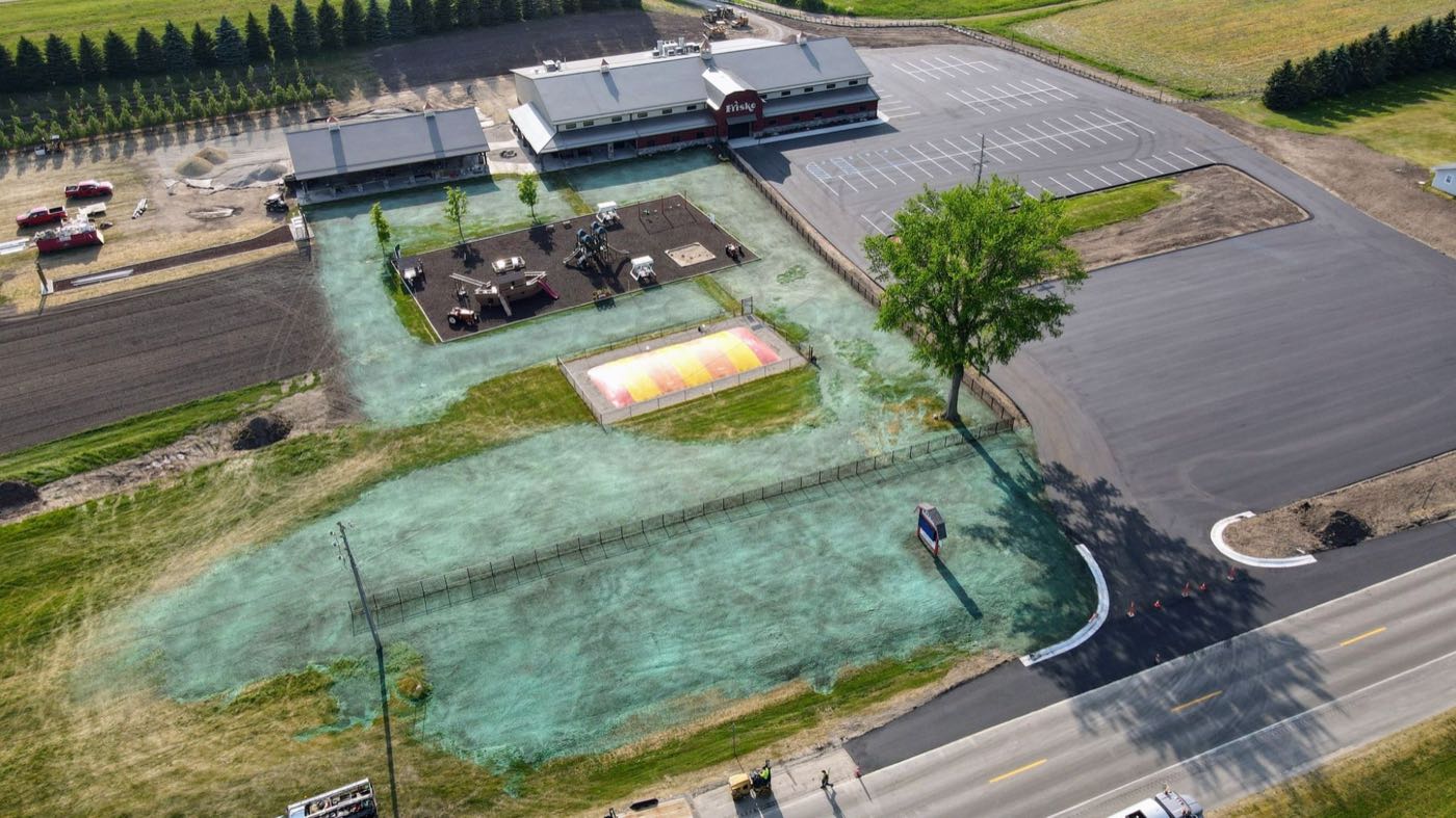 Playground and event lawn area with hydroseed coverage